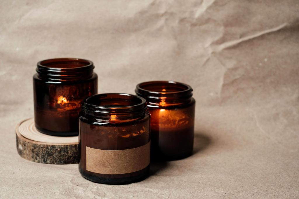 Artisan hand crafting custom candle with focus and precision